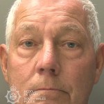 Custody photograph of Christopher Williams, a grey-haired man in his seventies, issued by South Wales Police