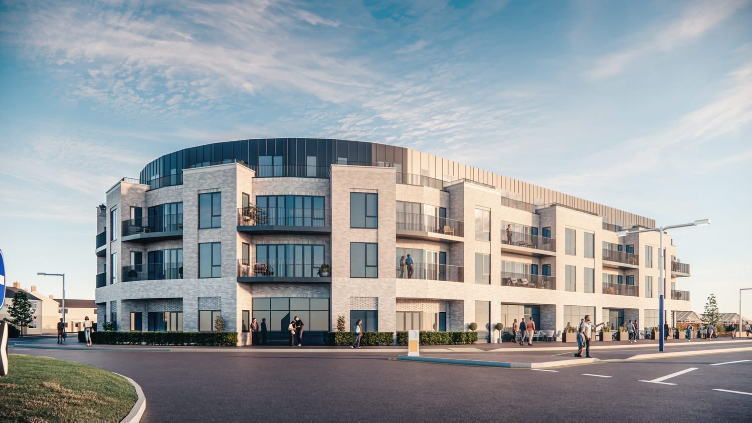 Computer-generated image of a curved three and four storey block in pale brick with balconies and a dark metal top floor on the roundabout corner of Princess Margaret Way, Aberavon, with cafe tables outside