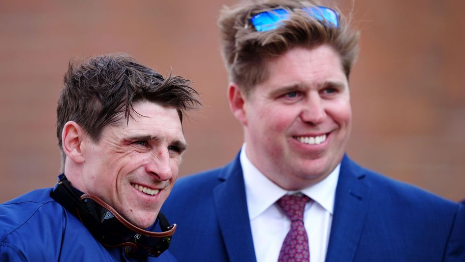 Jockey Harry Skelton, left, and his brother, trainer Dan Skelton, smiling at a racecourse