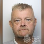 Dyfed-Powys Police custody photograph of Ian Stanton, a man with short spiky fair hair and grey stubble