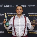 Jacob Lovell of Lovell Roofing, Gowerton, holding his Roofer of the Year trophy and a bottle of champagne at the Checkatrade Regional Awards for Midlands and Wales