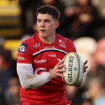 Scarlets centre Joe Hawkins with the ball in hand during a URC match