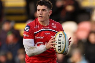 Scarlets centre Joe Hawkins with the ball in hand during a URC match
