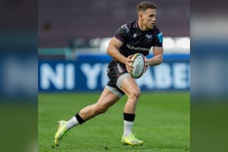 Ospreys scrum-half Kieran Hardy running with the ball