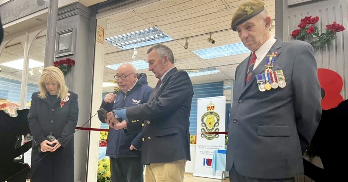 Lord-Lieutenant Sara Edwards and veterans with heads bowed at the ribbon-cutting for the Royal British Legion hub in Llanelli