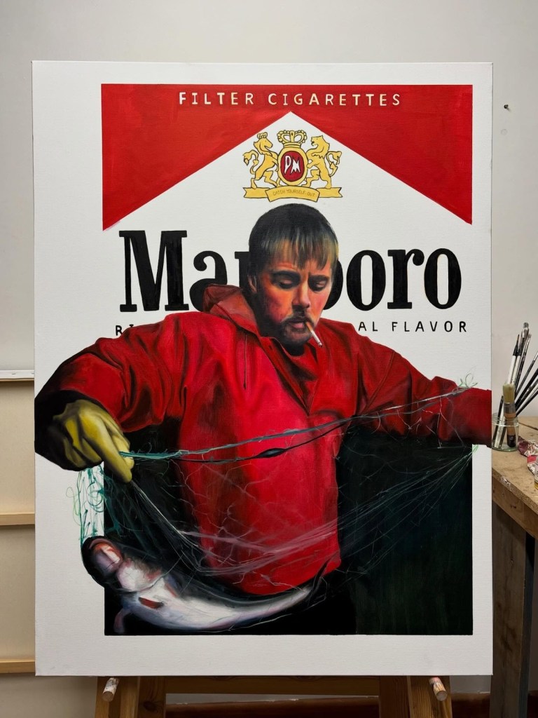 Painting on an easel of a young man in a red hoodie with a cigarette in his mouth, pulling a fish from a net, set against a giant Marlboro cigarette packet design