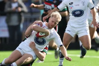 Swansea RFC full-back Mat Protheroe carries the ball into a tackle against Ebbw Vale
