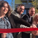 Guests cut a red ribbon to open Mowbray Yard in Swansea city centre