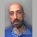 Custody photograph of Mustafa Al-Khafaji