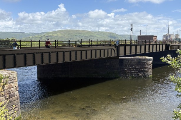 Artist's impression of the restored Newbridge Road Bridge in Port Talbot, a riveted iron girder bridge on stone piers over the River Afan with walkers and a cyclist crossing