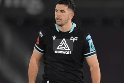 Ospreys centre Owen Watkin in the club's black home kit during a match under floodlights