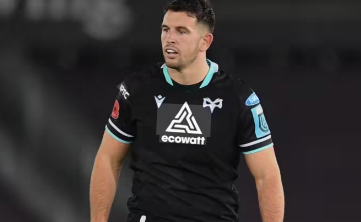Ospreys centre Owen Watkin in the club's black home kit during a match under floodlights