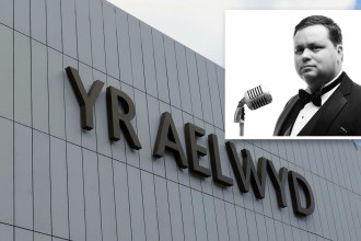 Paul Potts in a bow tie beside a vintage microphone, inset over the Yr Aelwyd lettering on Port Talbot's rebuilt theatre