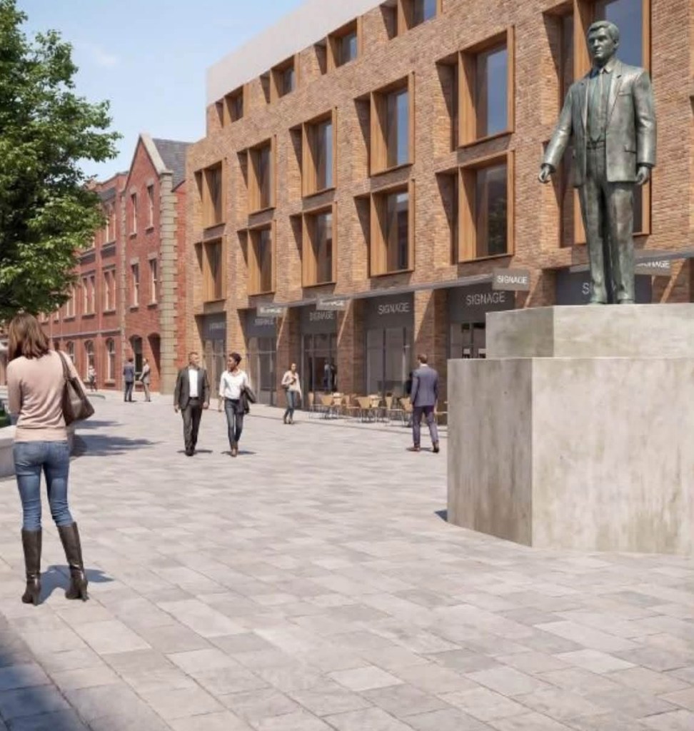 Artist's impression of a paved street lined with brick buildings and shopfronts, with a bronze statue on a stone plinth