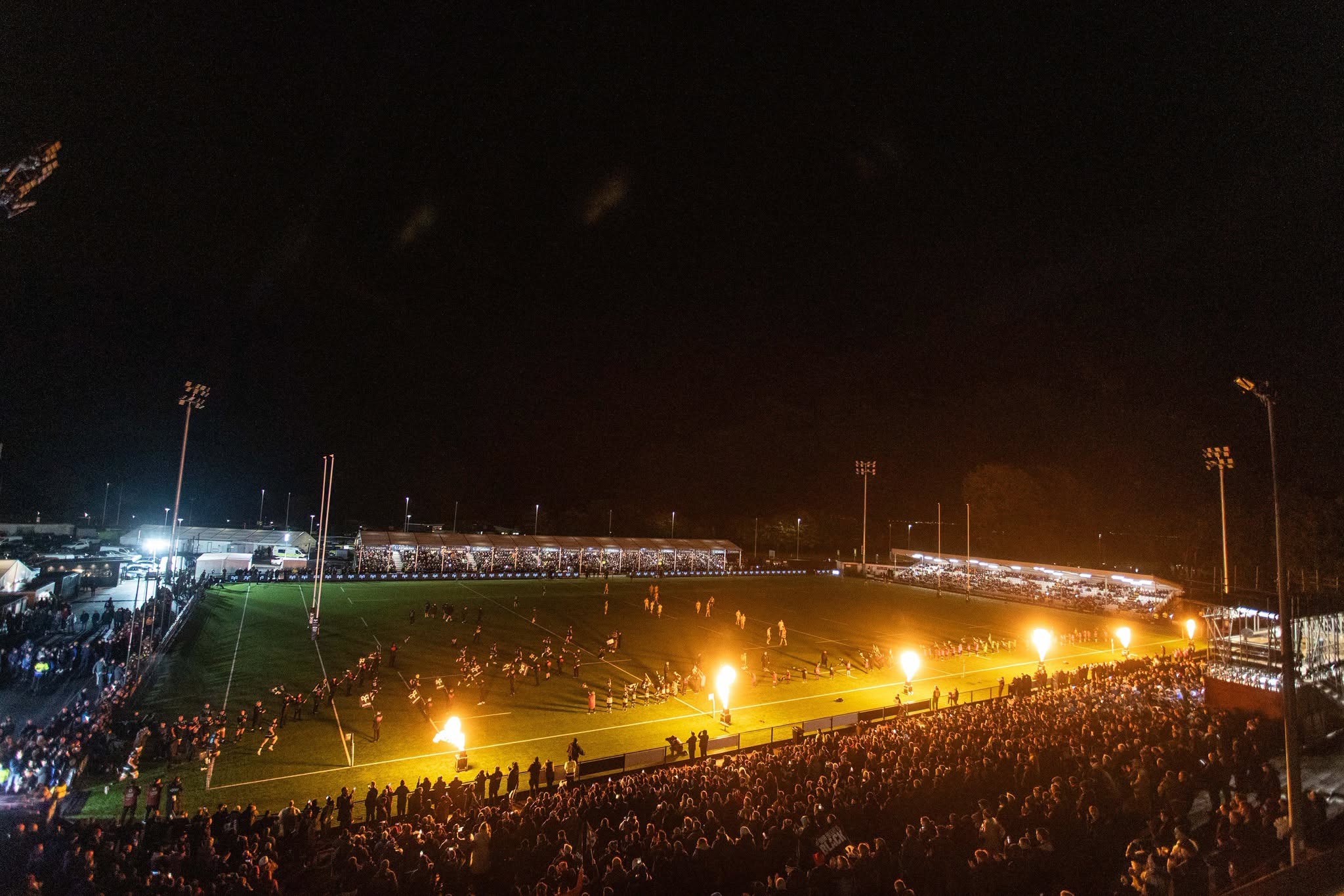 Flames shooting up along the touchline as the Ospreys run out under the floodlights at a packed St Helen’s at night