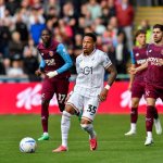 Swansea City's Ronald, number 35, on the ball against West Ham at the Swansea.com Stadium, with West Ham players closing in