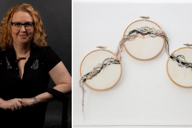 Tammy Danielle Davies, with red curly hair and glasses, beside her artwork of three embroidery hoops joined by trails of thread