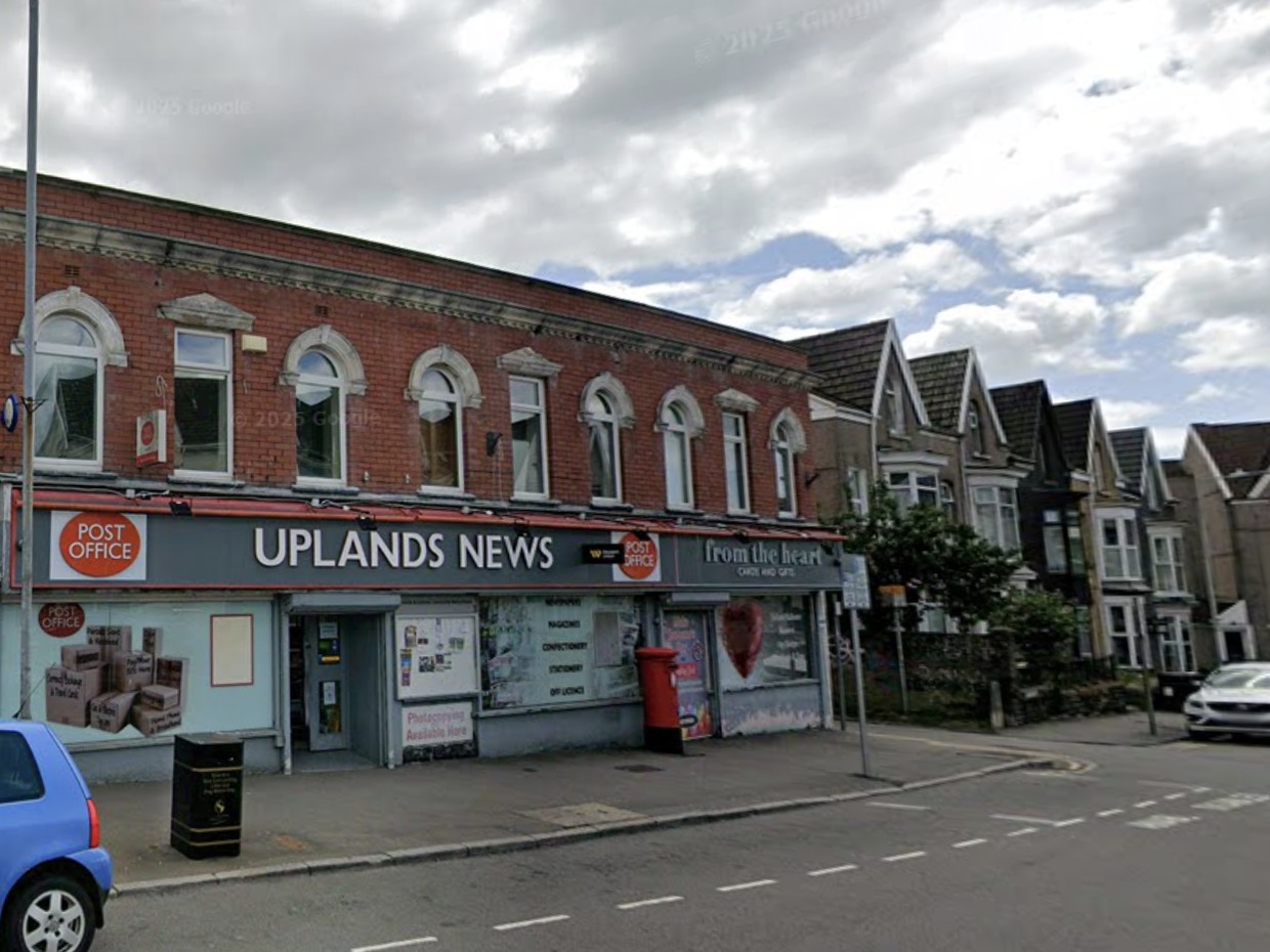 Uplands News on Gwydr Square, a red-brick parade with Post Office signs on its grey fascia, a red postbox outside and From the Heart cards and gifts next door