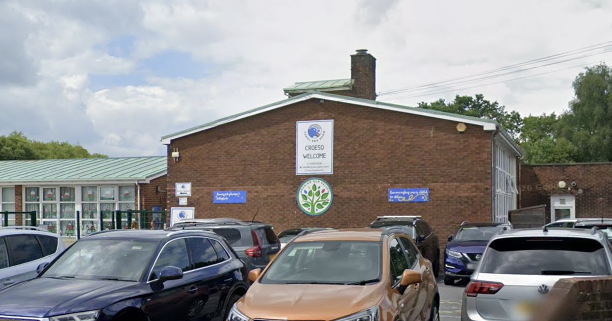 The front of Ysgol Bro Banw primary school in Ammanford, a red-brick building with a Croeso Welcome sign